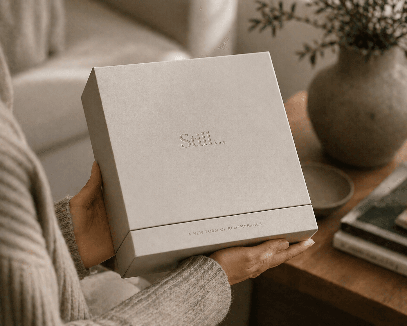 A Still… box held in two hands